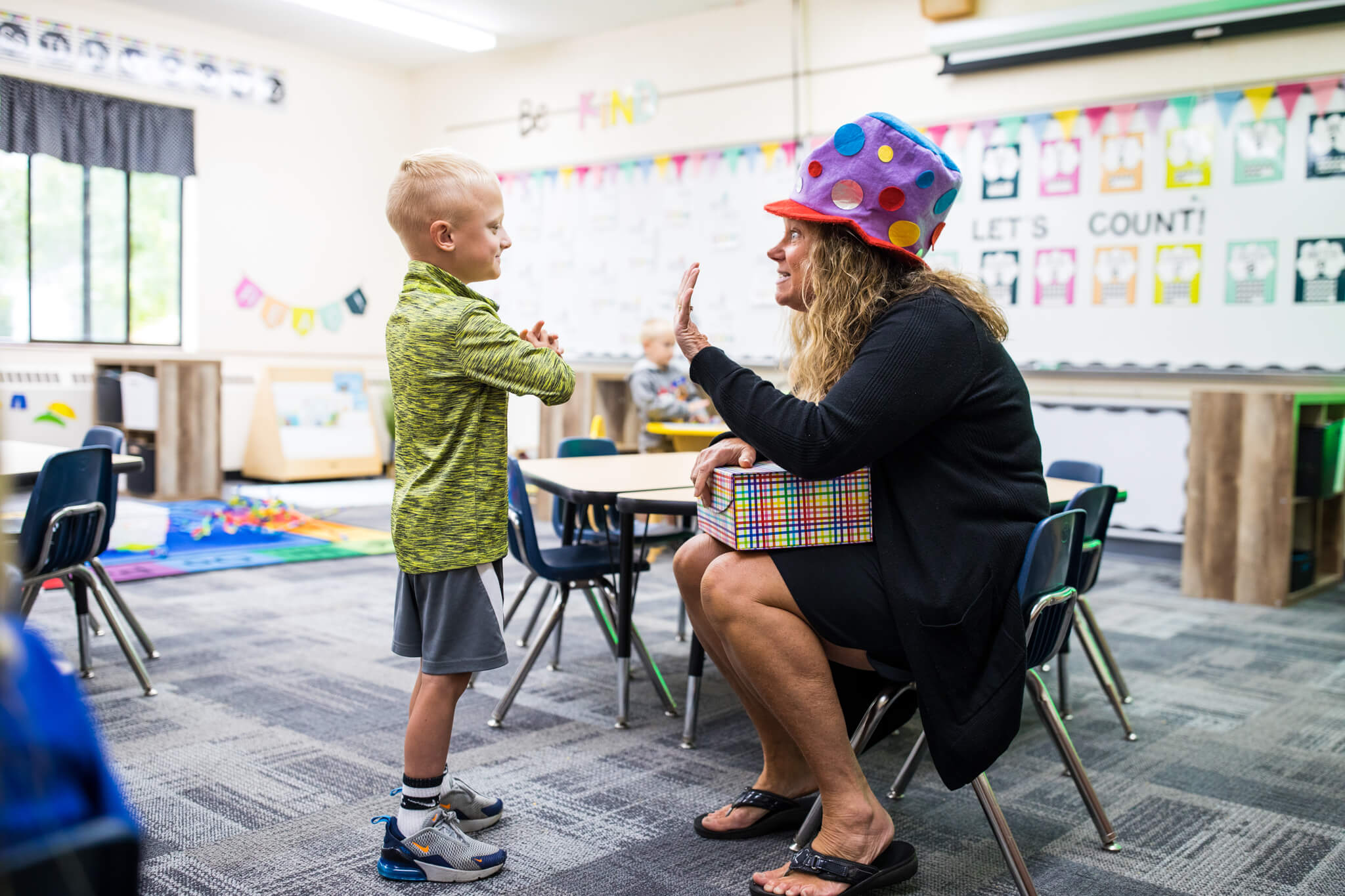 Teacher engaging with a student's birthday at HCS.