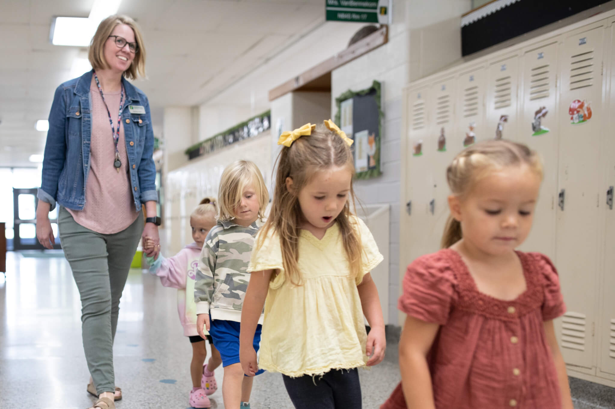 Preschool kids walking in the hallway at HCS.