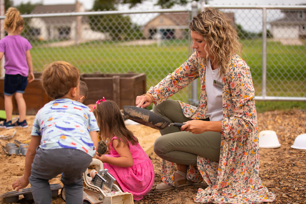 A teacher interacts during outdoor teaching during 3 School at Hudsonville Christian Preschool.