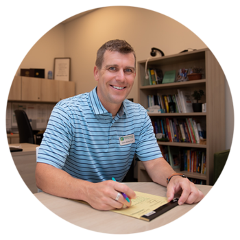 The middle school principal sitting in his office at Hudsonville Christian School in Michigan.
