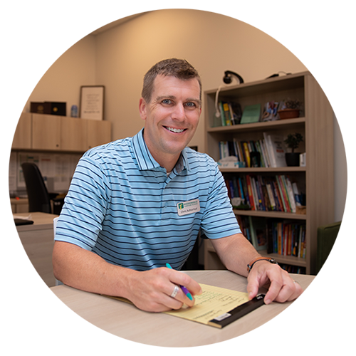 The middle school principal sitting in his office at Hudsonville Christian School in Michigan.