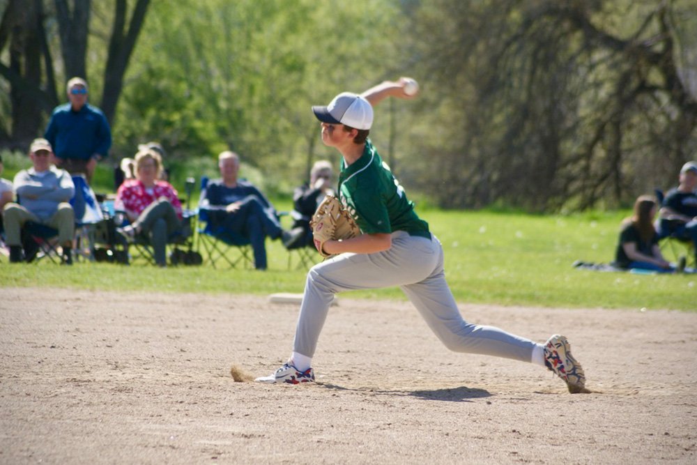 A baseball player pitching during a game at Hudsonville Christian Middle School.