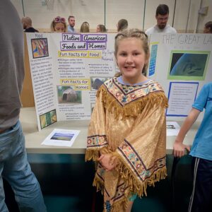 3rd grade student shows school history project